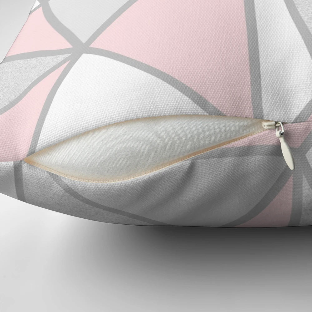 A soft, modern grey and pink geometric throw pillow with a contemporary abstract design
