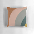 Minimalist pillow featuring an abstract pattern in shades of teal, grey, blush pink, and rust.