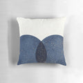 Navy blue abstract circle design on a textured throw pillow