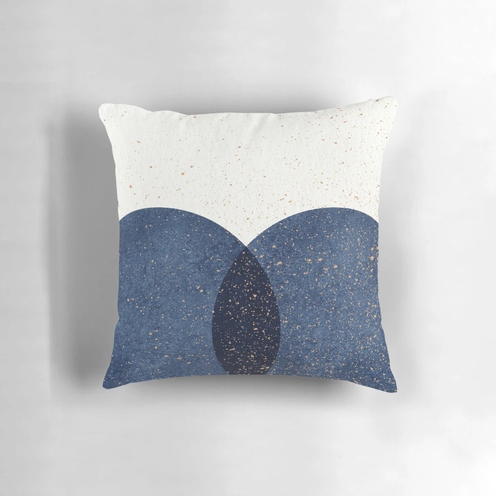 Navy blue abstract circle design on a textured throw pillow