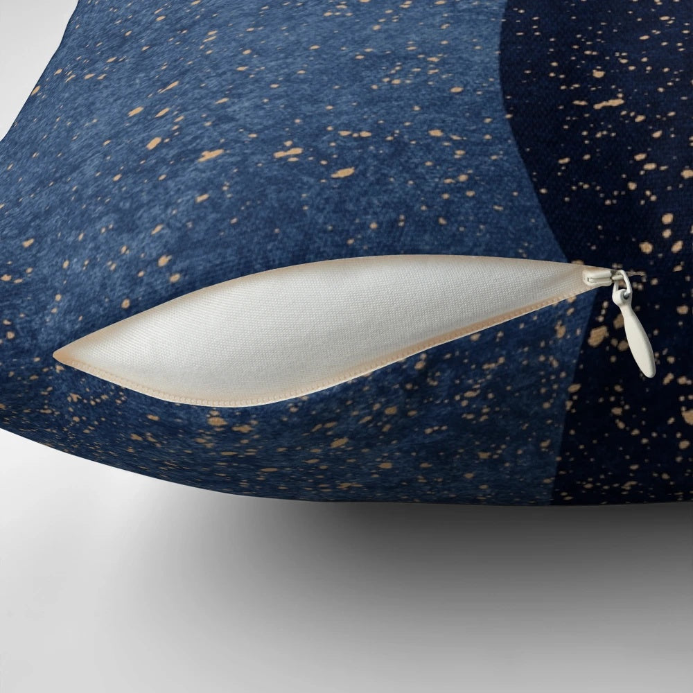 Navy blue abstract circle design on a textured throw pillow