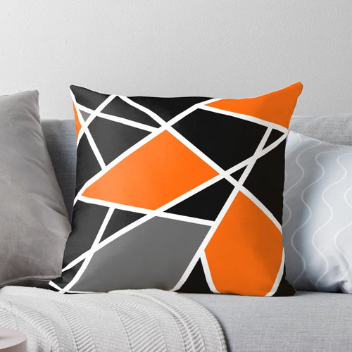 "Modern orange geometric pattern pillow with abstract lines and shapes for boho-inspired home decor"