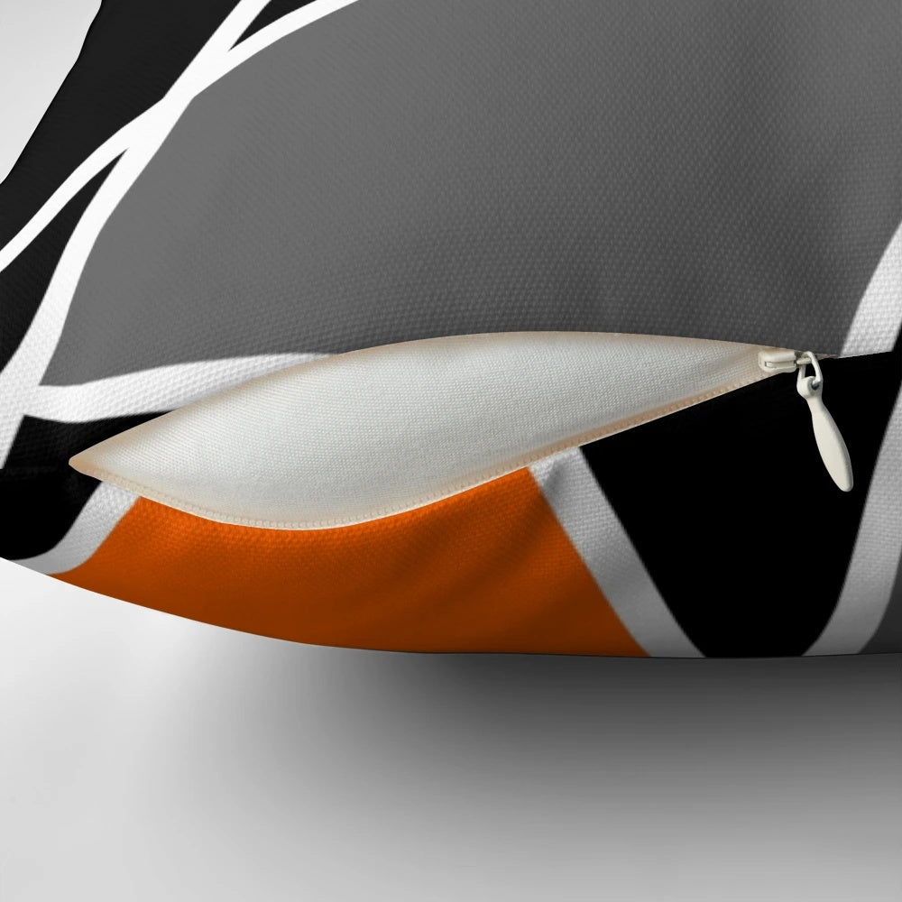 "Modern orange geometric pattern pillow with abstract lines and shapes for boho-inspired home decor"