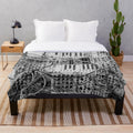 Plush blanket with analog synthesizer inspired modular design in black and white