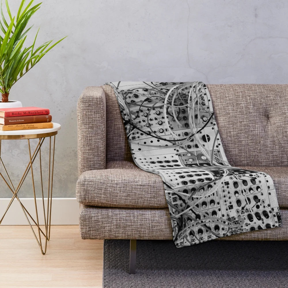 Plush blanket with analog synthesizer inspired modular design in black and white