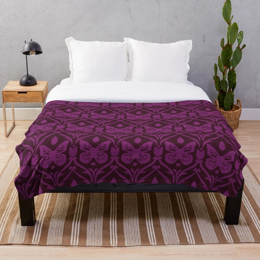 Monarch inspired plush blanket with purple and royal butterfly pattern