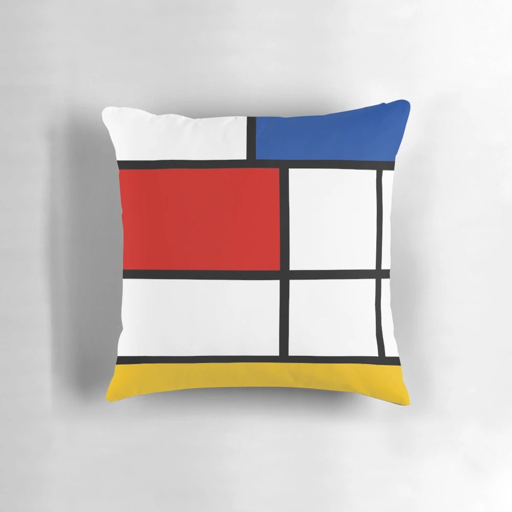 Colorful geometric throw pillow with Mondrian-style abstract design in red, yellow, and blue