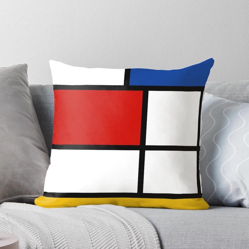 Colorful geometric throw pillow with Mondrian-style abstract design in red, yellow, and blue