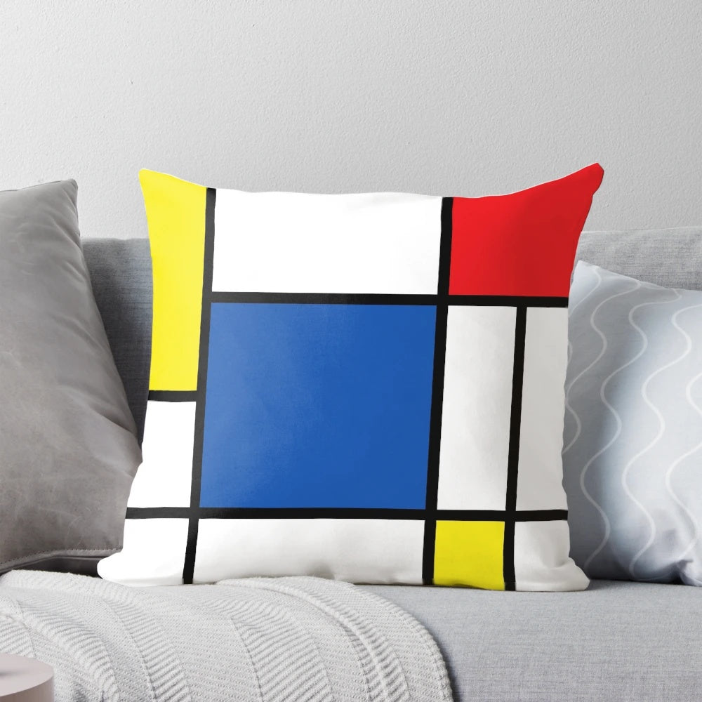Mondrian-inspired geometric pillow with bold primary colors and intersecting lines, creating a modern abstract art piece.