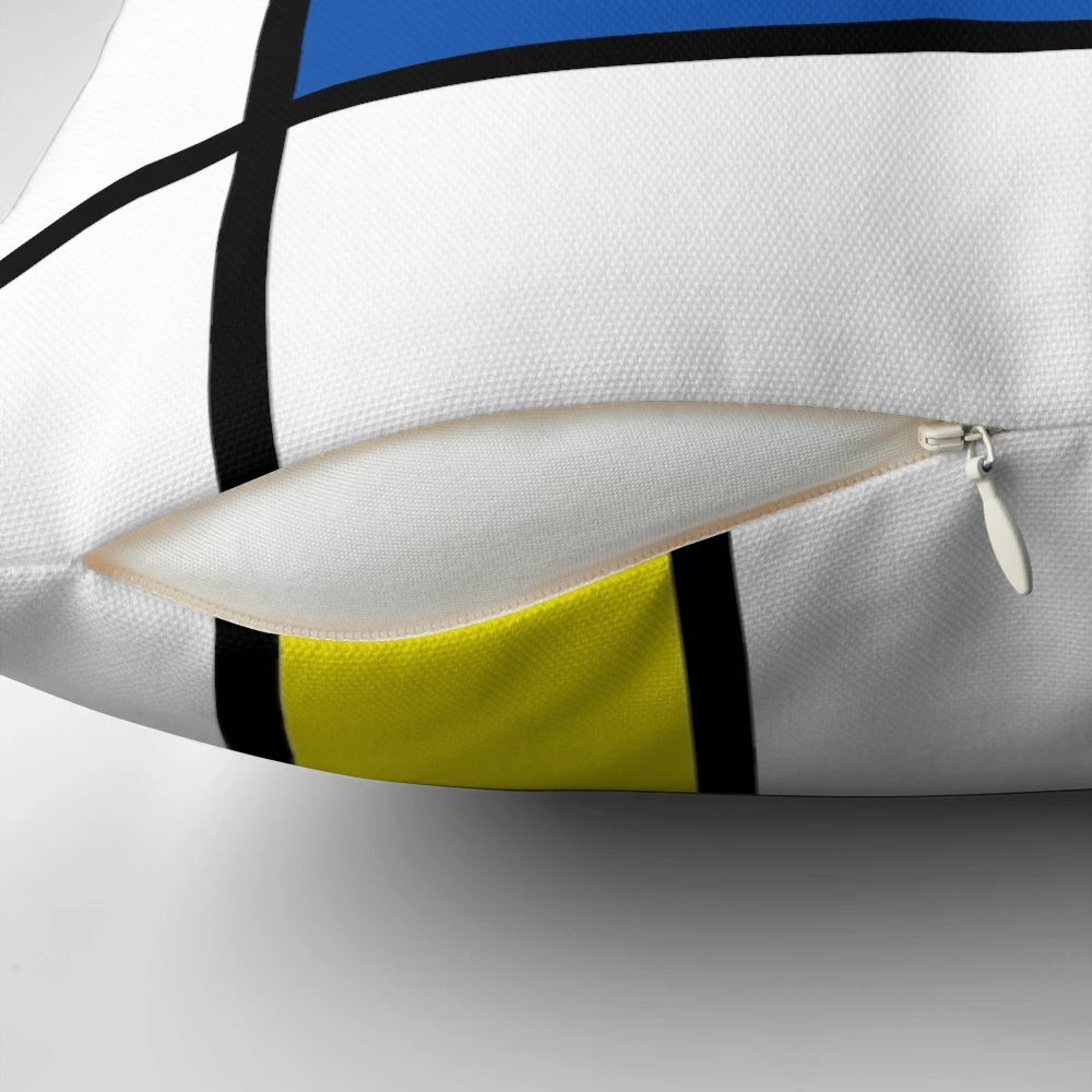Mondrian-inspired geometric pillow with bold primary colors and intersecting lines, creating a modern abstract art piece.