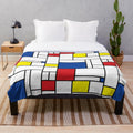 Mondrian-inspired minimalist plush blanket with abstract color block design