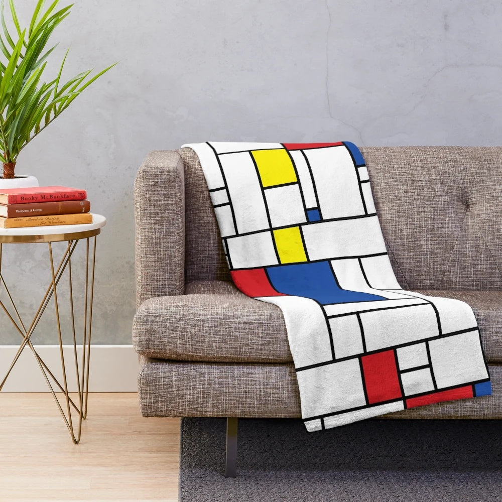 Mondrian-inspired minimalist plush blanket with abstract color block design