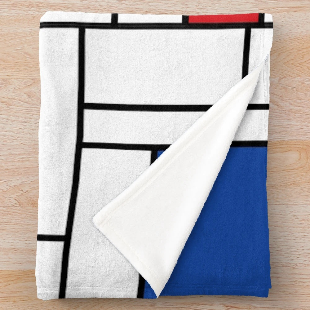 Mondrian-inspired minimalist plush blanket with abstract color block design