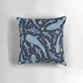 Monochrome blue watercolor image of a shark swimming in the ocean on a black background