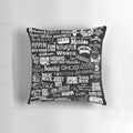 Black and white pillow with a broadway-themed design