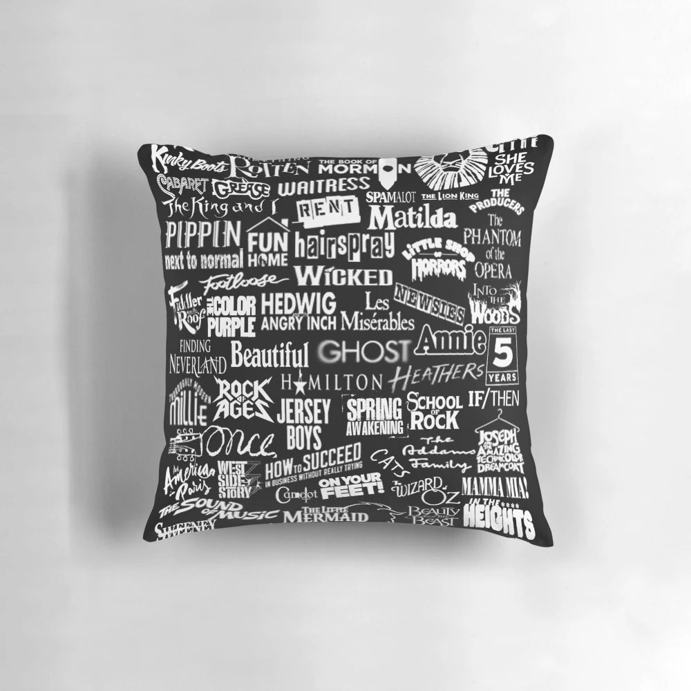 Black and white pillow with a broadway-themed design