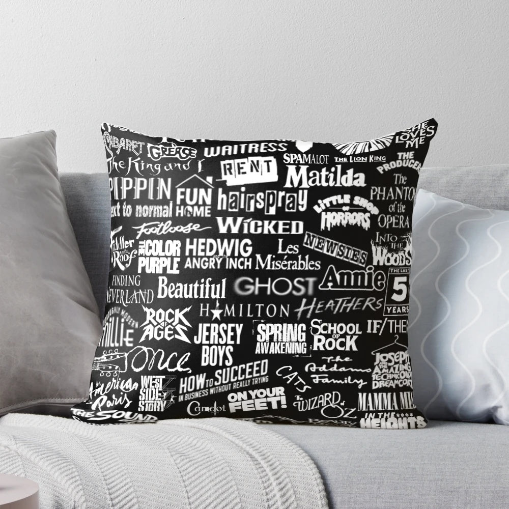 Black and white pillow with a broadway-themed design
