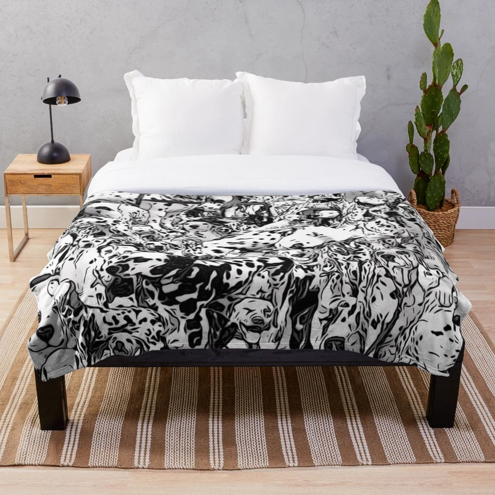 Dalmation print plush blanket with black and white dog collage design