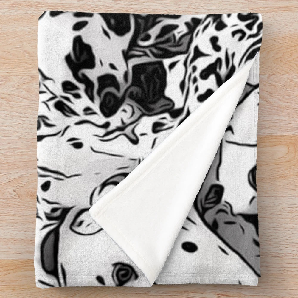 Dalmation print plush blanket with black and white dog collage design
