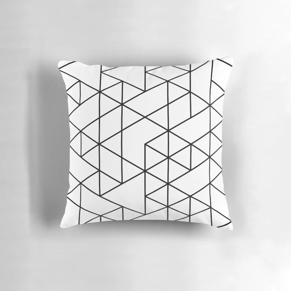 Black and white pillow with abstract triangular pattern, ideal for minimalist and Scandinavian-inspired home decor.