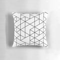 Black and white pillow with abstract triangular pattern, ideal for minimalist and Scandinavian-inspired home decor.