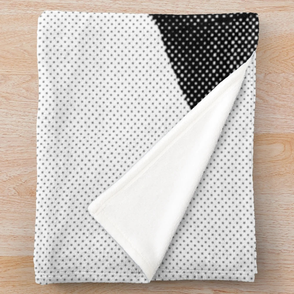 A stylized black and white portrait of actor Jon Hamm printed on a soft, plush blanket