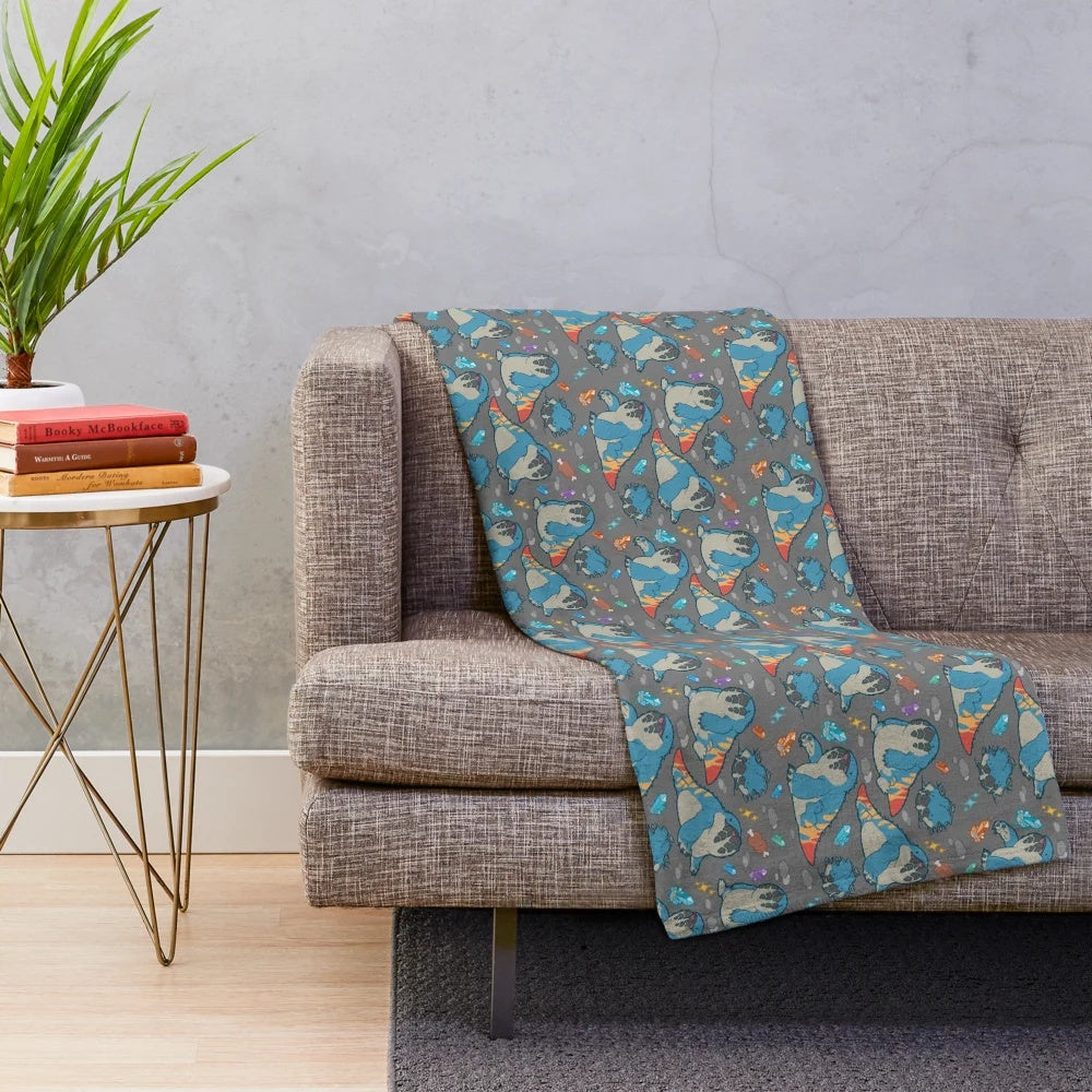 Monster Hunter-inspired grey plush blanket featuring the Dodogama creature