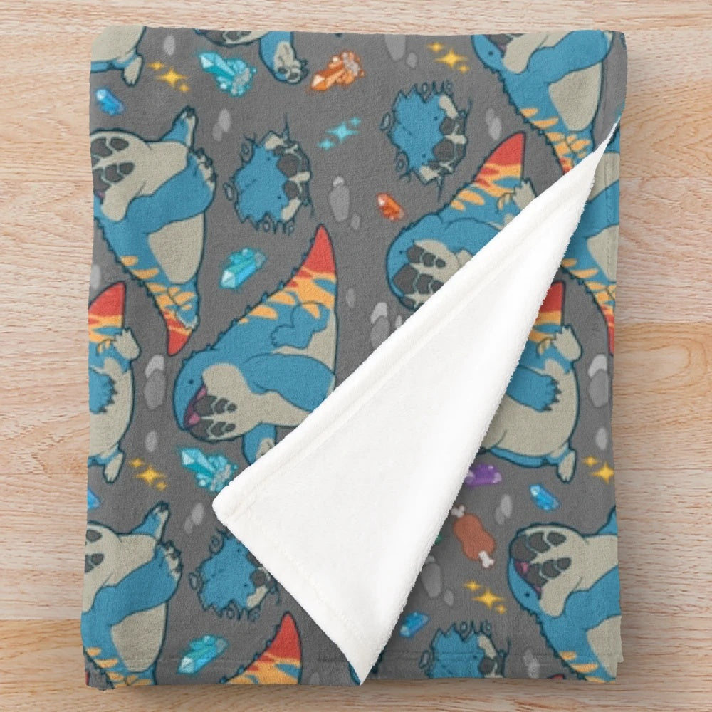 Monster Hunter-inspired grey plush blanket featuring the Dodogama creature