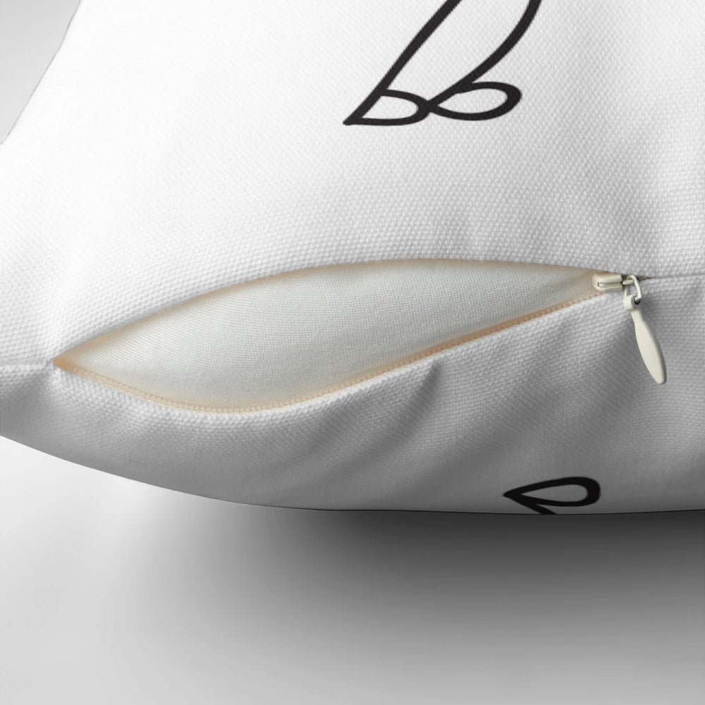 A cozy "I Love You" pillow with a tic tac toe design, perfect for monthsary celebrations.