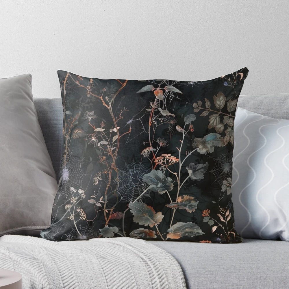 Moody gothic boho style throw pillow with a botanical foliage and celestial design