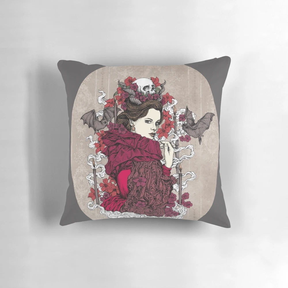 Moody, dark gothic-style pillow with a skull and bat design