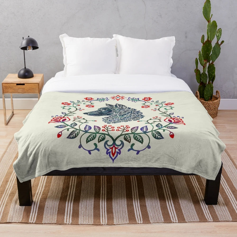 A vibrant plush blanket featuring a graphic design of a Mudi dog in a folk art style wreath