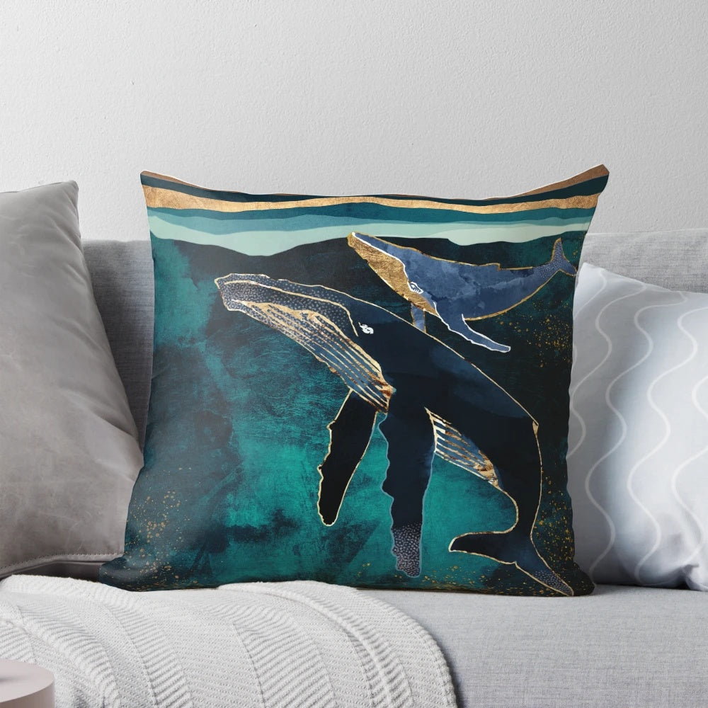 Moonlit whales floating in a serene, abstract underwater landscape on a decorative pillow.