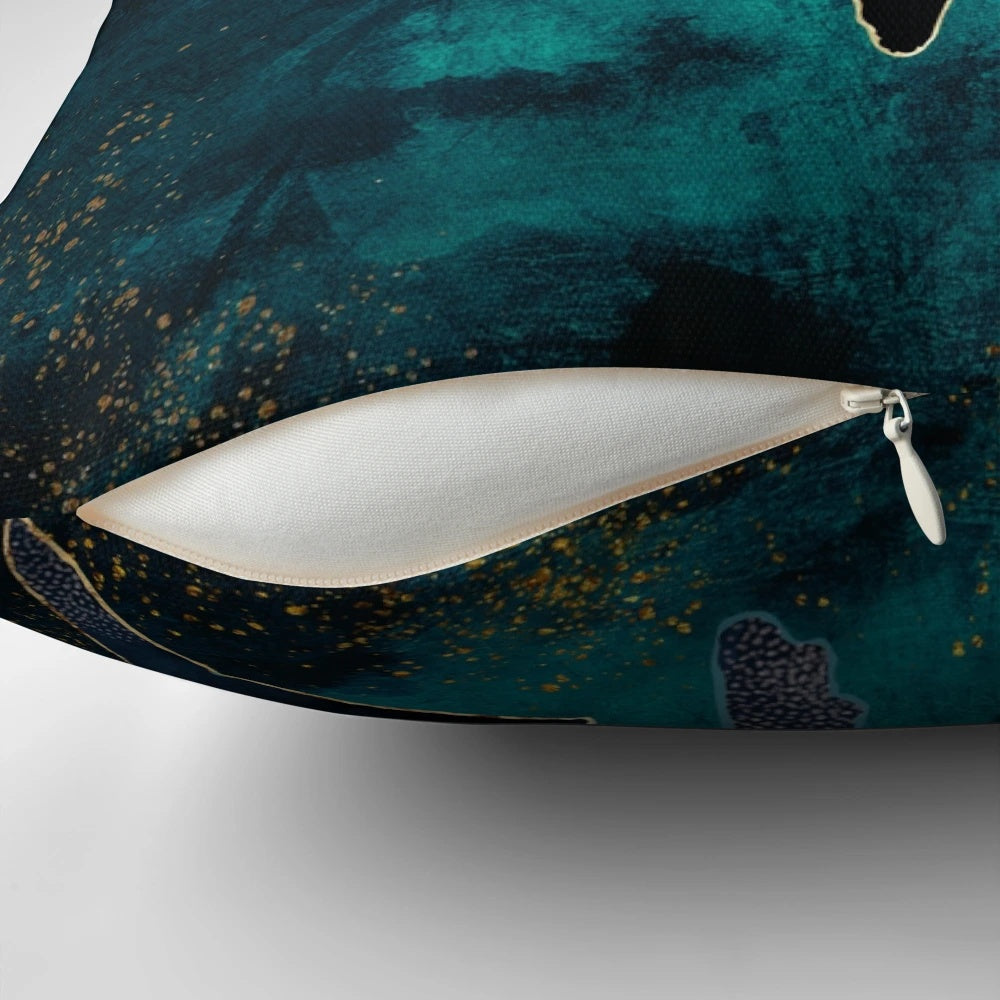 Moonlit whales floating in a serene, abstract underwater landscape on a decorative pillow.