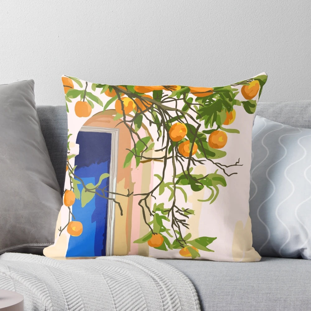 A vibrant, boho-style decorative pillow featuring an architectural building and orange botanical patterns, perfect for a Moroccan-inspired or travel-themed home.