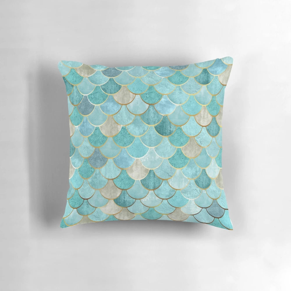 Moroccan-inspired mermaid fish scale pattern in teal and aqua colors on a decorative throw pillow.