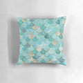 Moroccan-inspired mermaid fish scale pattern in teal and aqua colors on a decorative throw pillow.