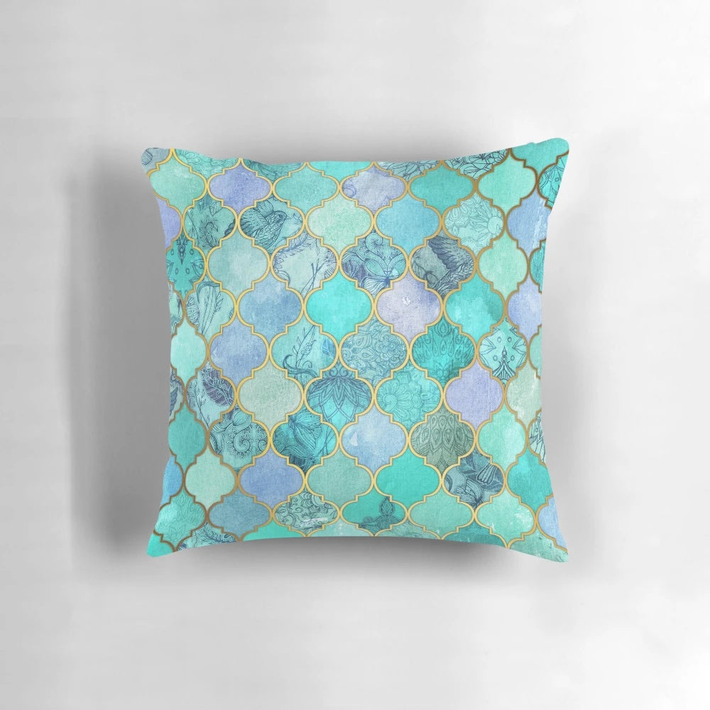 Decorative Moroccan tile pattern throw pillow in mint green, jade, and gold colors with a watercolor bird design.