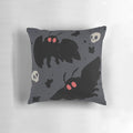 Soft, grey Mothman pillow with a cute, fluffy design and subtle skull motif.