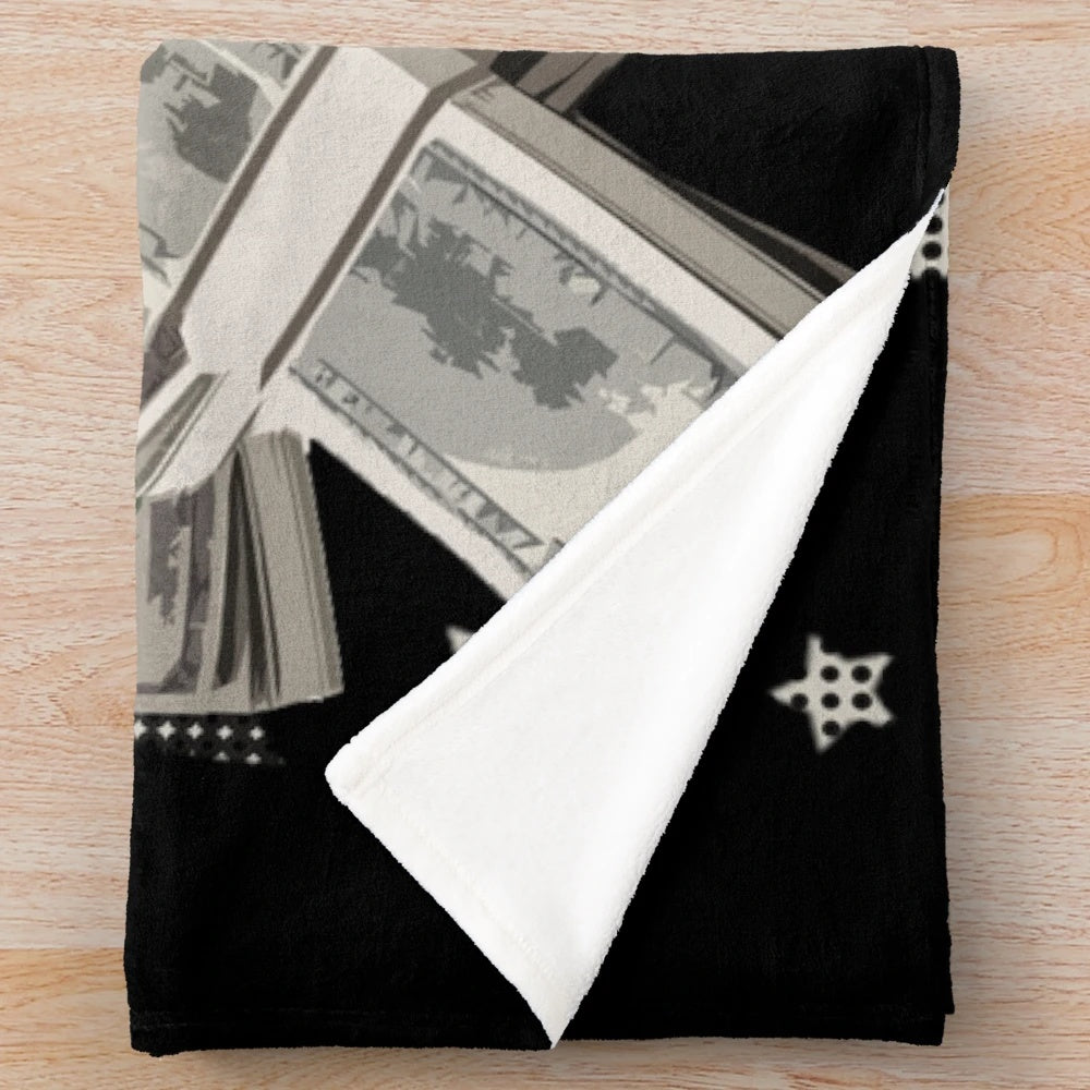 Plush blanket with dollar bill design, featuring a motivational money-themed pattern