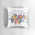 Pillow with the text "Grow Through What You Go Through" and a bouquet of flowers
