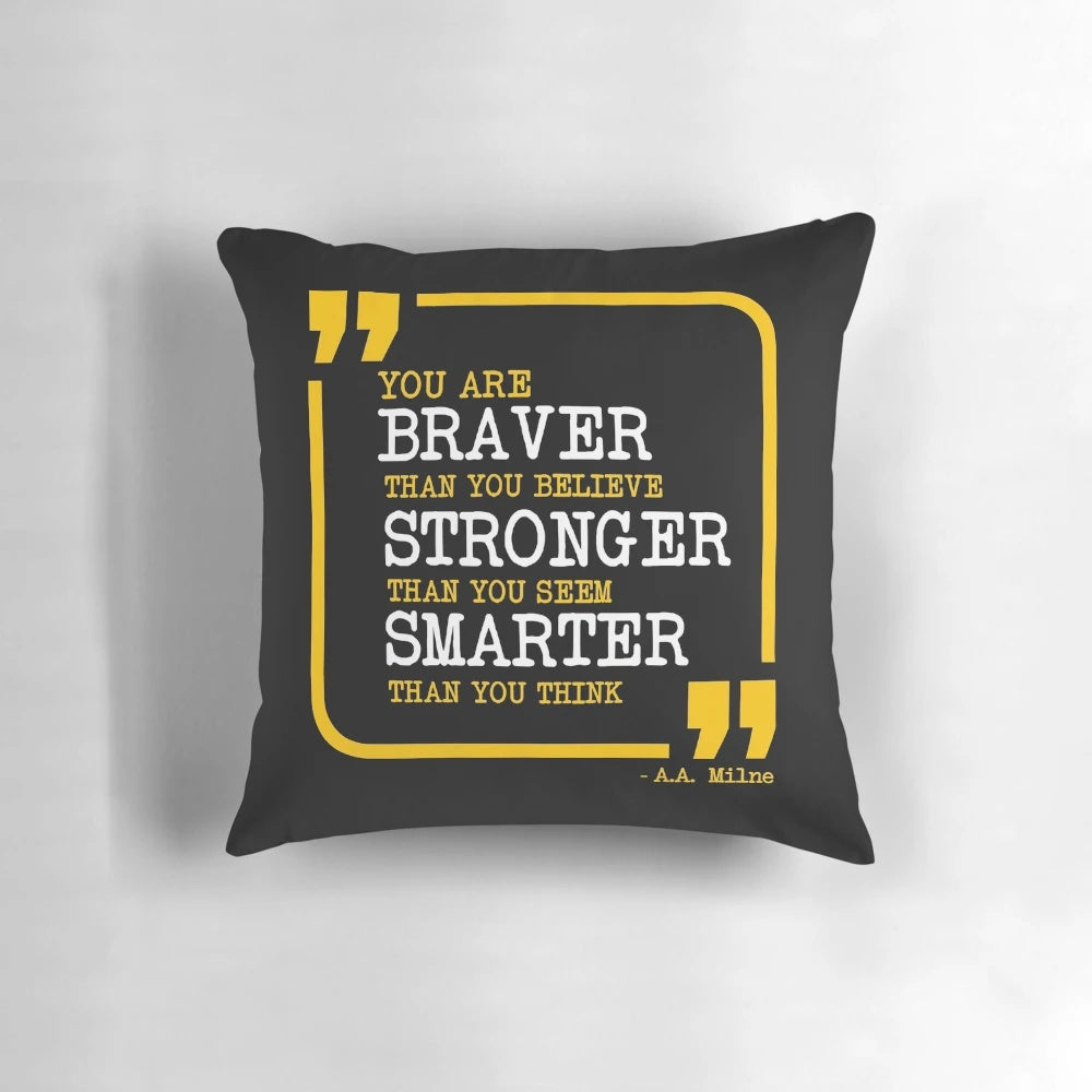 Inspirational pillow with the text "You are braver, stronger, smarter" printed on it.