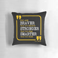 Inspirational pillow with the text "You are braver, stronger, smarter" printed on it.