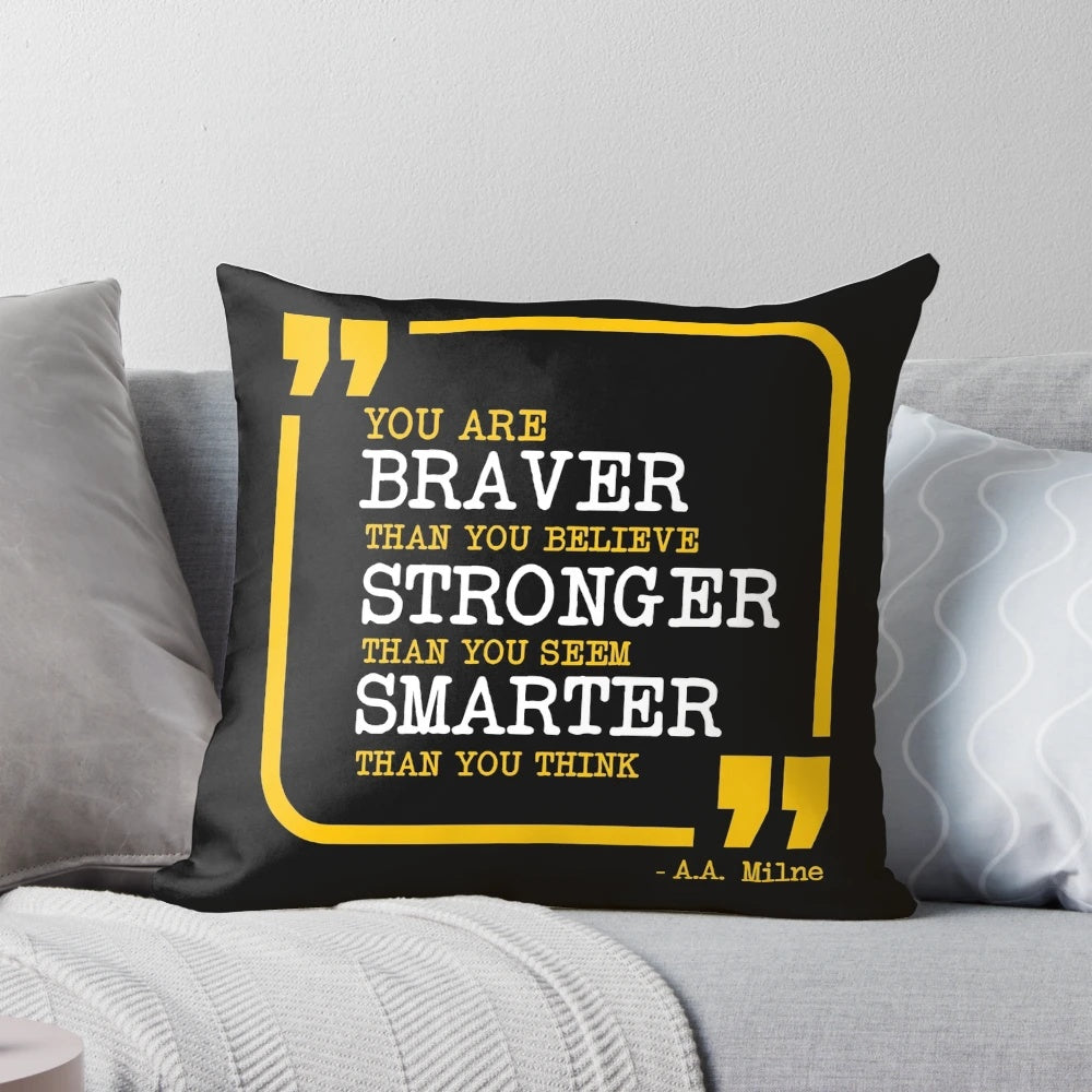 Inspirational pillow with the text "You are braver, stronger, smarter" printed on it.
