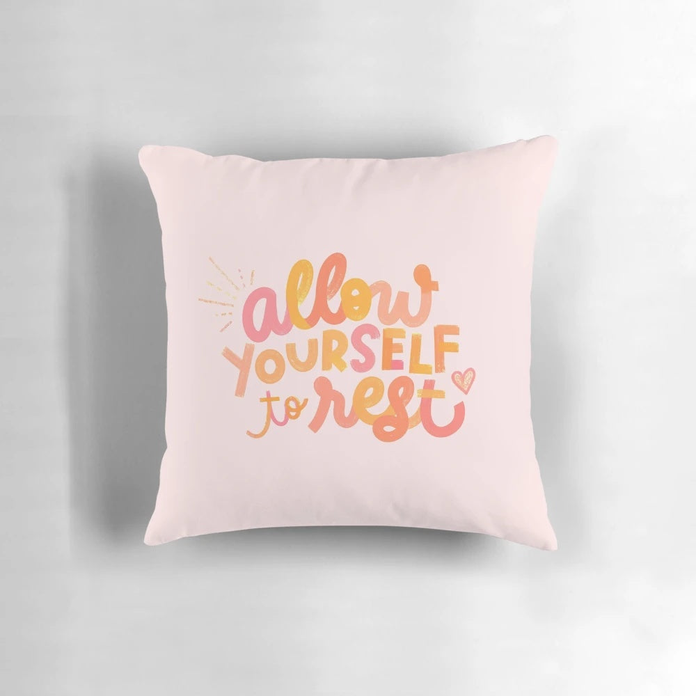 Bright, neon-colored 'Rest Pillow' with inspirational quote for home and bedroom decor