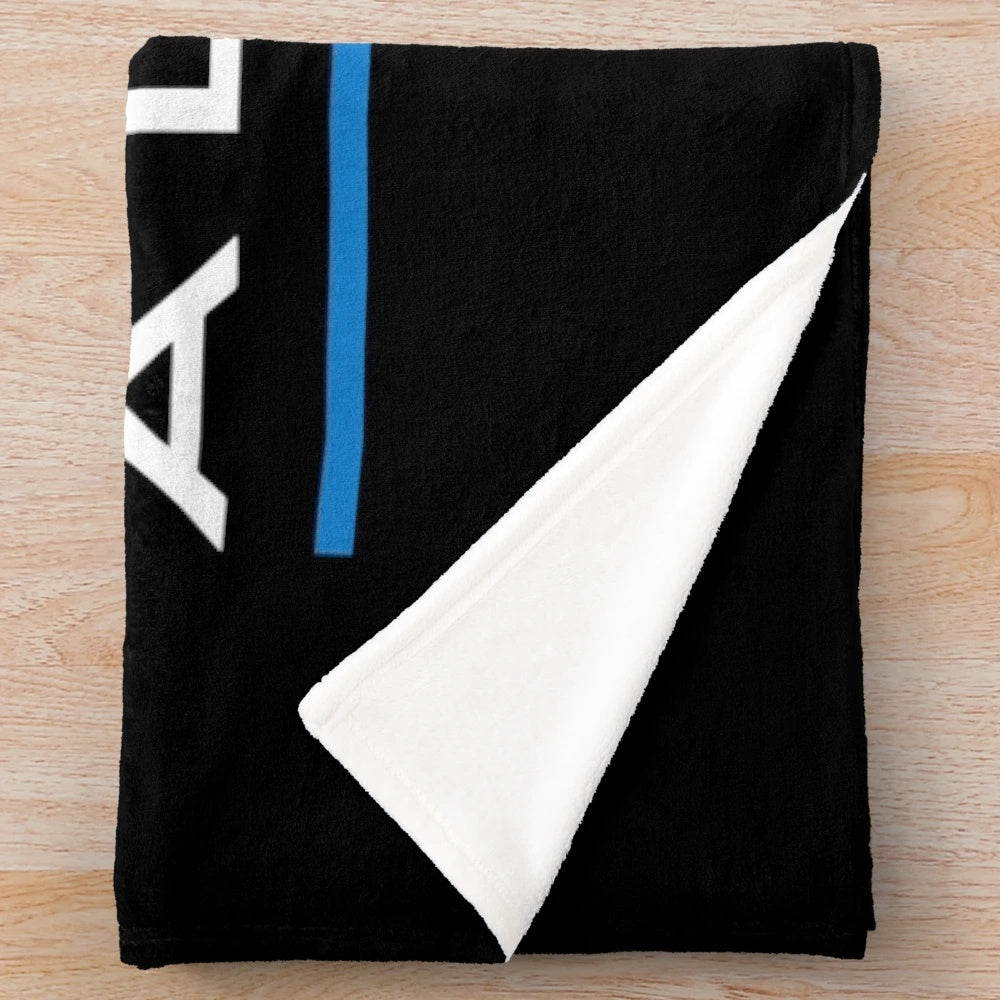 Motorsports-inspired plush blanket featuring a racing team design
