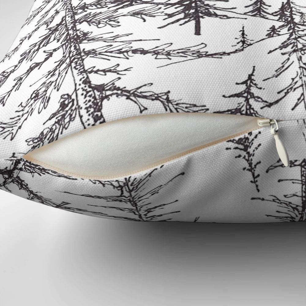 Mountain pillow featuring a landscape of pine trees and a majestic mountain range