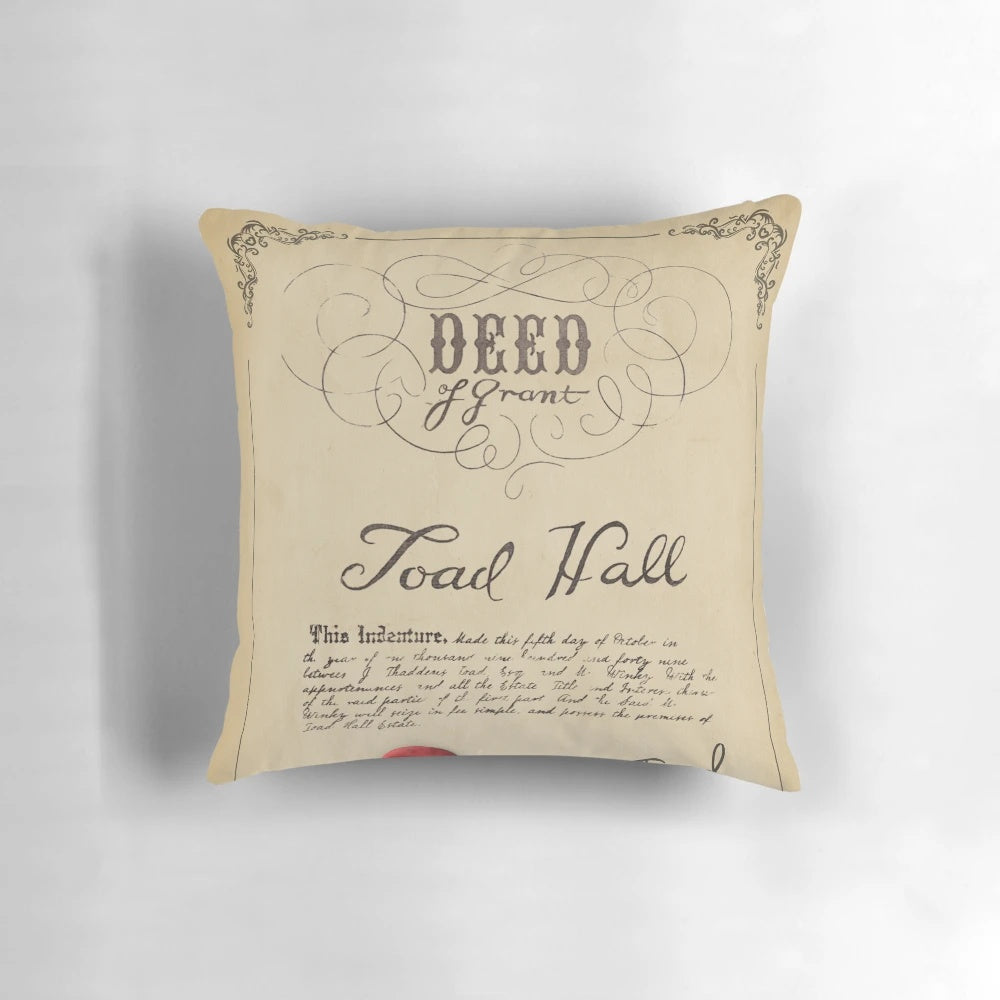 Decorative pillow featuring the deed to Toad Hall from the story of Mr. Toad