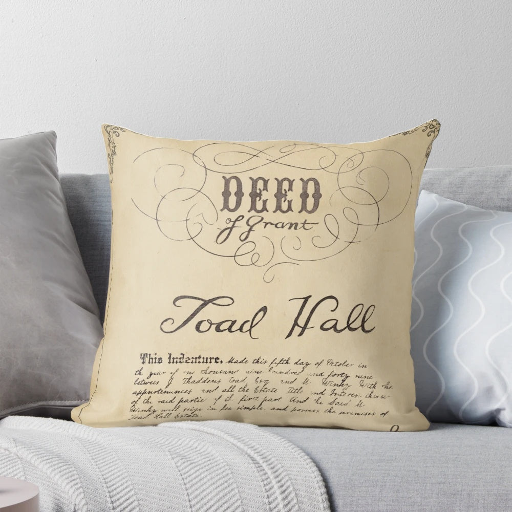 Decorative pillow featuring the deed to Toad Hall from the story of Mr. Toad