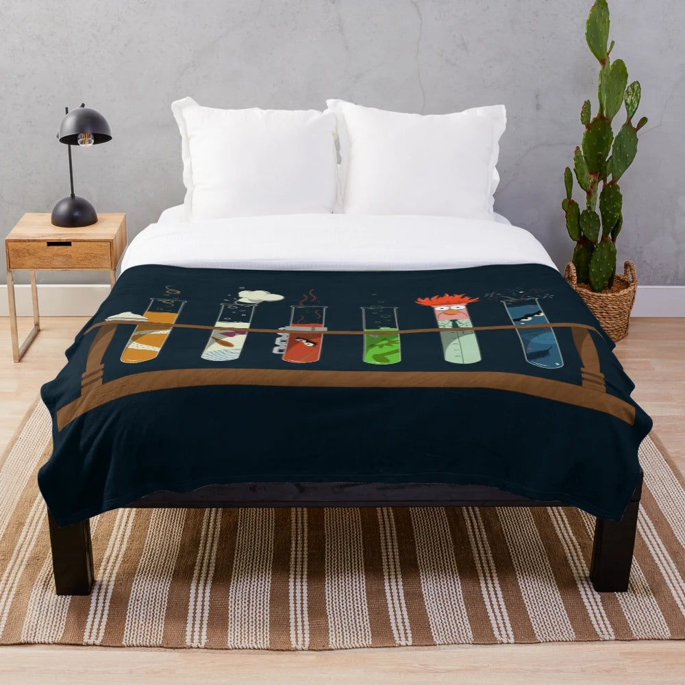 Muppet-inspired chemistry plush blanket with beaker, test tube, and Muppet character designs